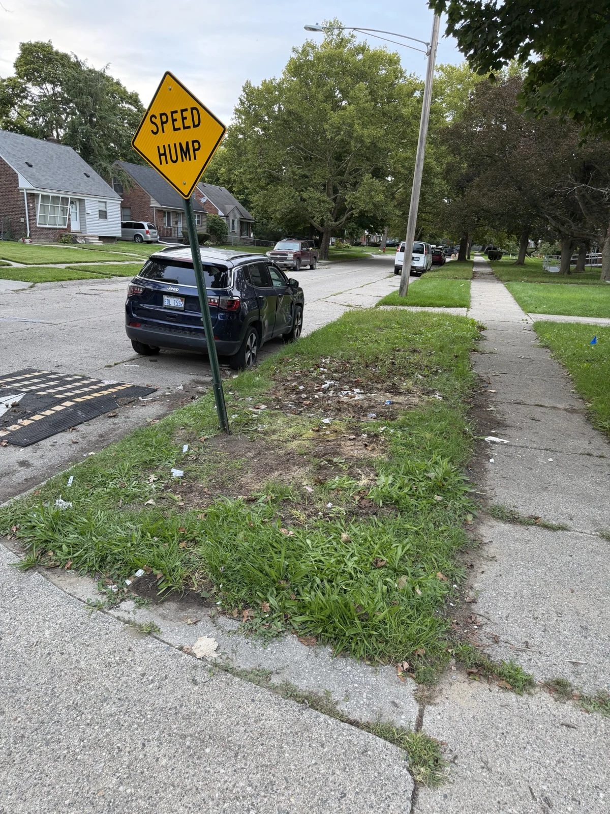 The same curbside area after the large pile of bags and debris was removed